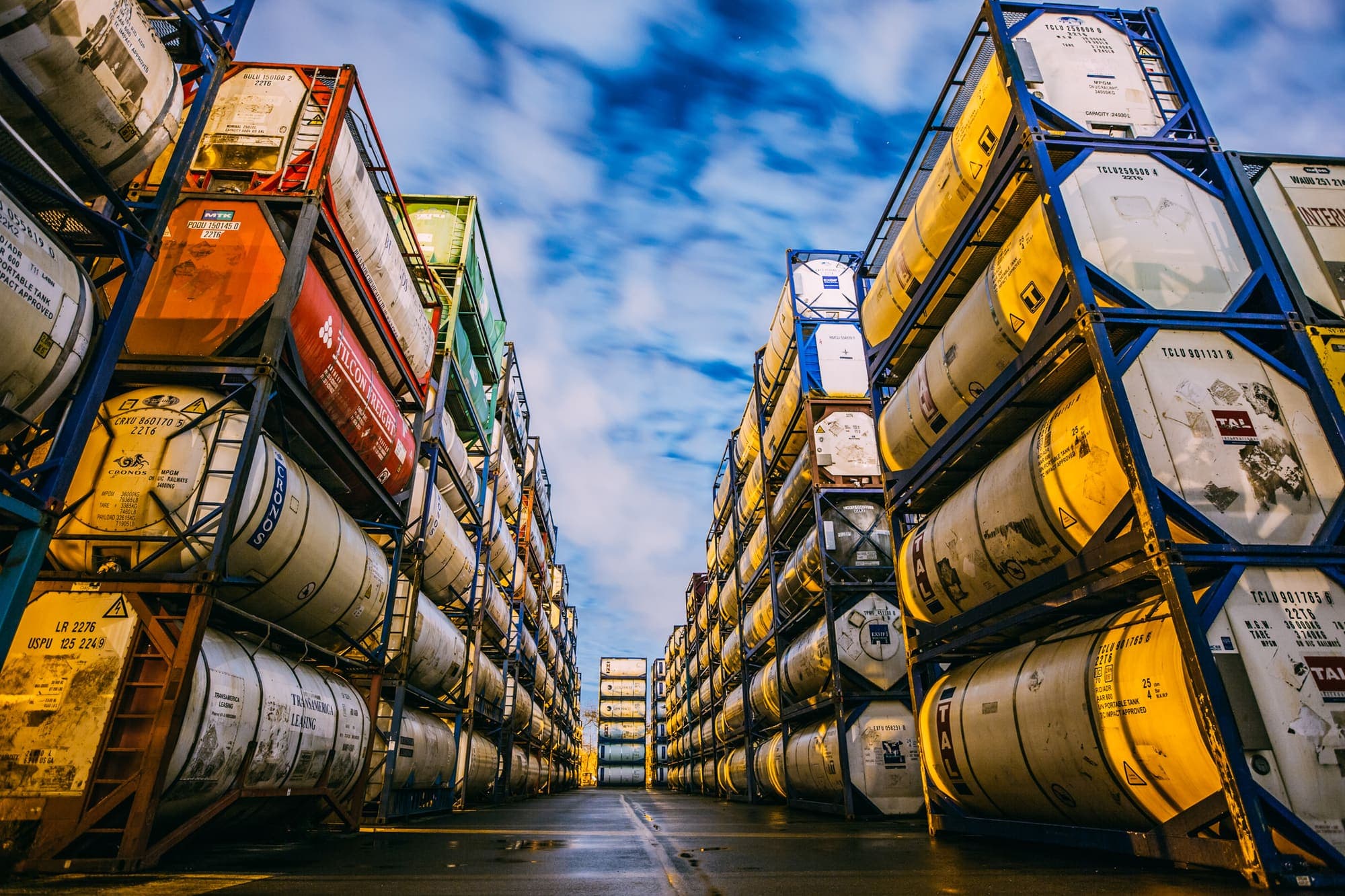 Rows of stacked tank containers at a logistics storage yard